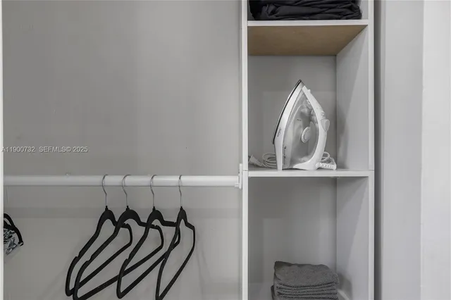 a view of a livingroom with rack and shoes