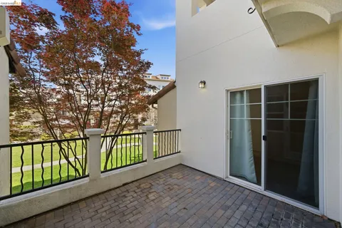 a view of balcony with small garden