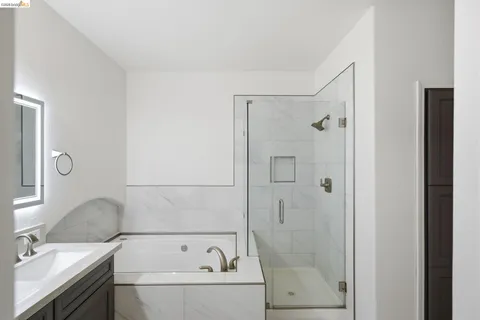 a bathroom with a bathtub and a sink