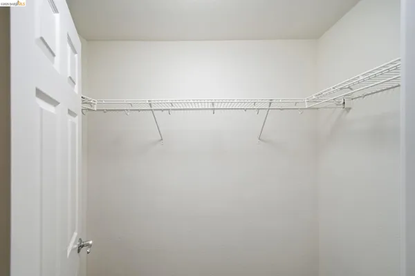 a bathroom with a granite countertop sink shower and a mirror