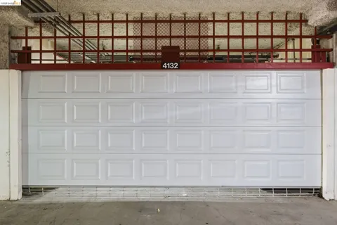 a view of an empty room with wooden walls