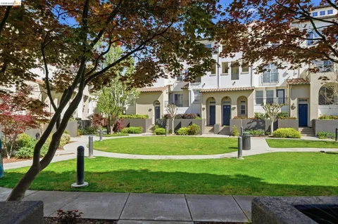 a front view of building with green space