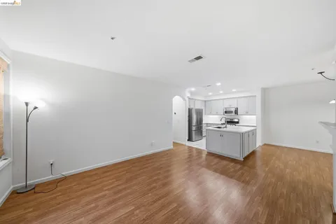a view of a kitchen with wooden floor