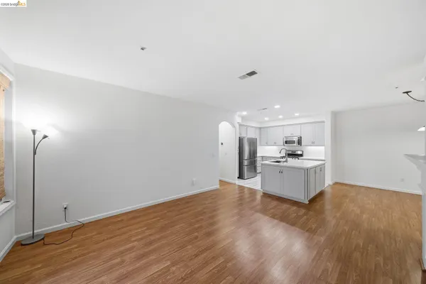 a view of a kitchen with wooden floor