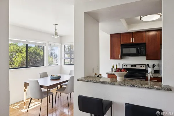 a view of a dining room with furniture window and wooden floor