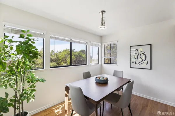 a kitchen with stainless steel appliances granite countertop a sink and a stove
