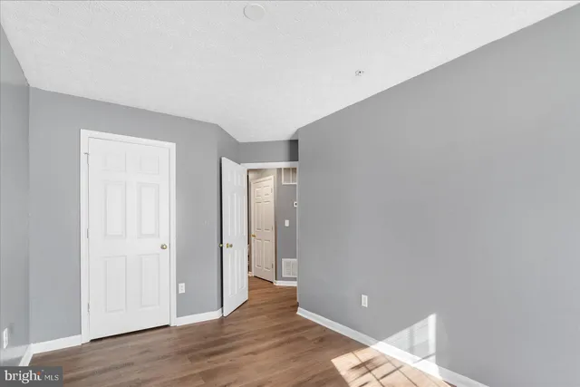 a view of a livingroom with wooden floor