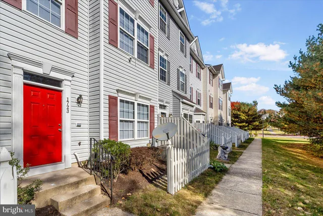 a view of a brick building with many windows