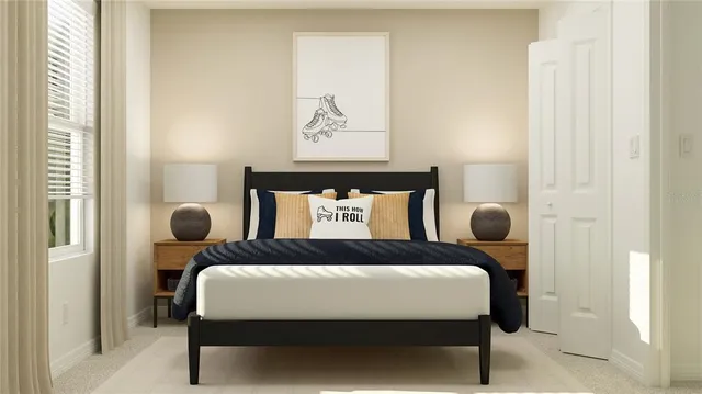 a bedroom with a bed and painting on the wall