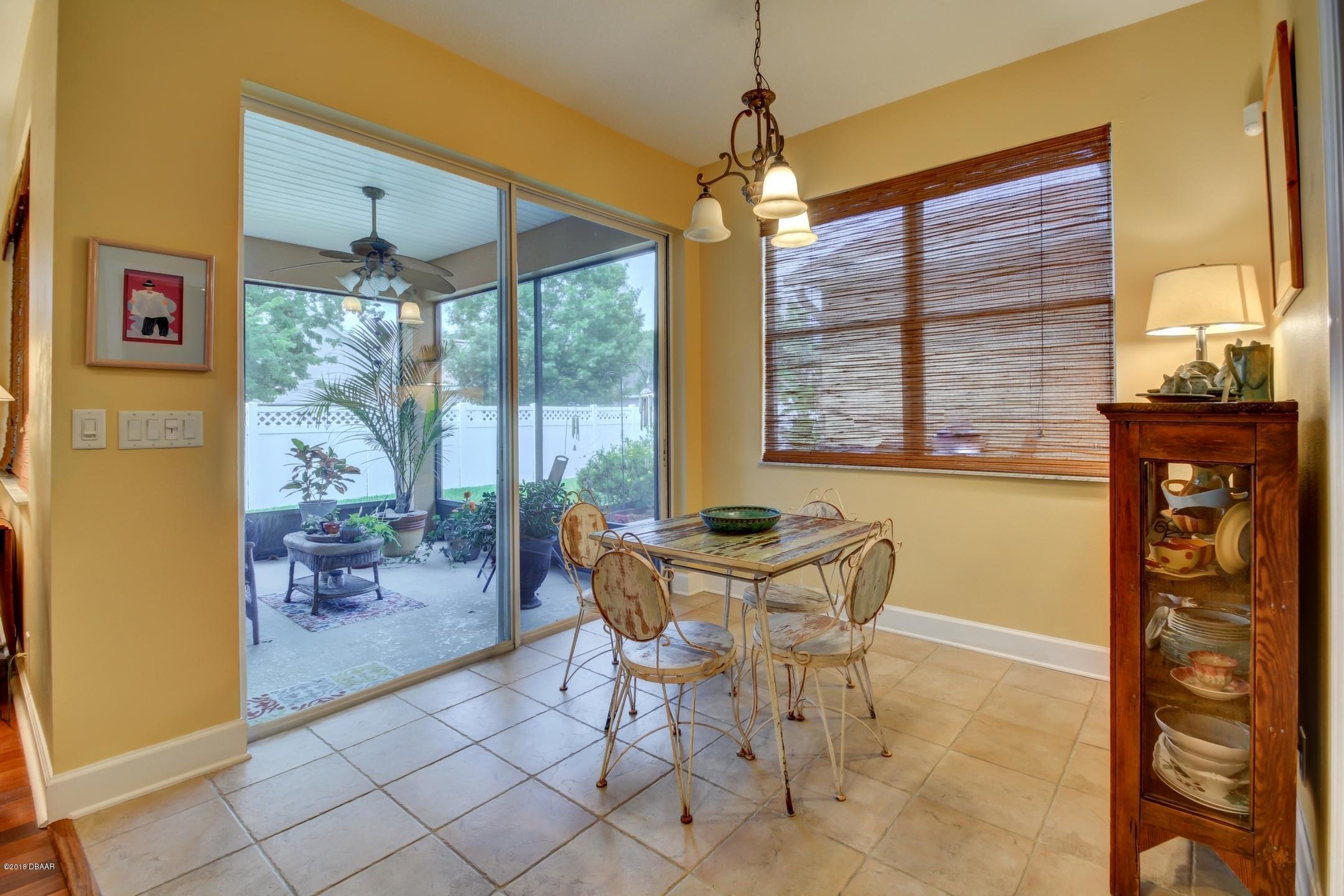 409 Manor View Lane DeLand, FL 32724 - Photo 16 of 31 a dining room with furniture and window