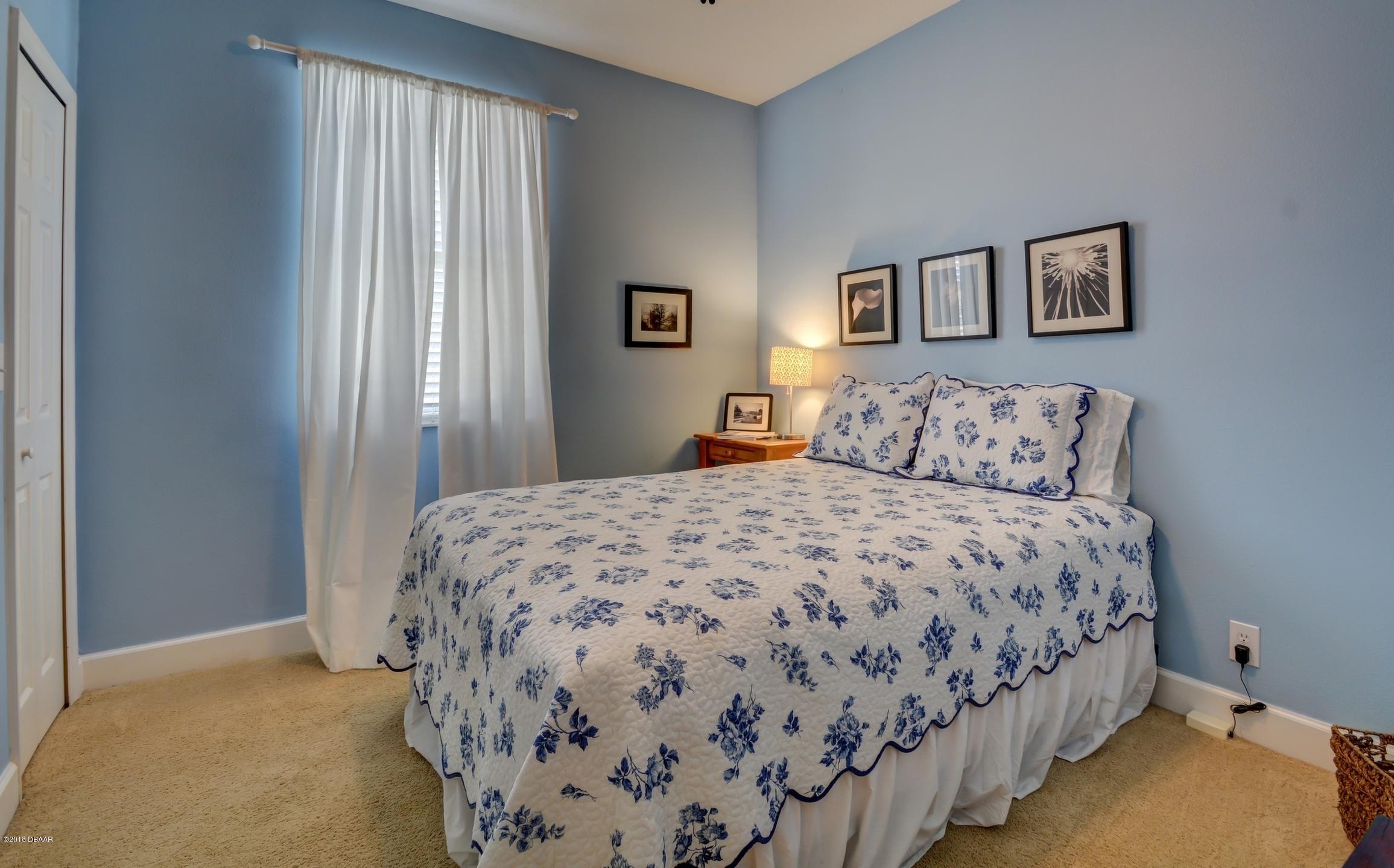 409 Manor View Lane DeLand, FL 32724 - Photo 24 of 31 a bedroom with double bed and a window