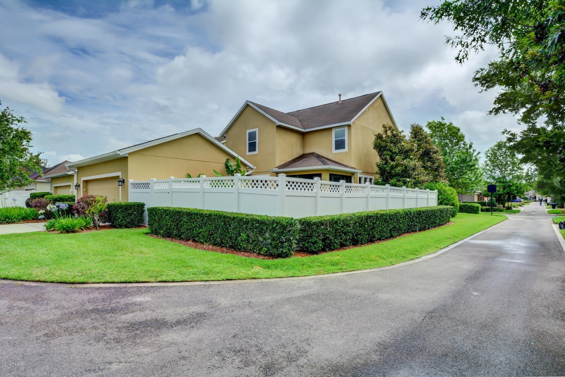 409 Manor View Lane DeLand, FL 32724 - Photo 25 of 31 a view of a house with a yard and large trees