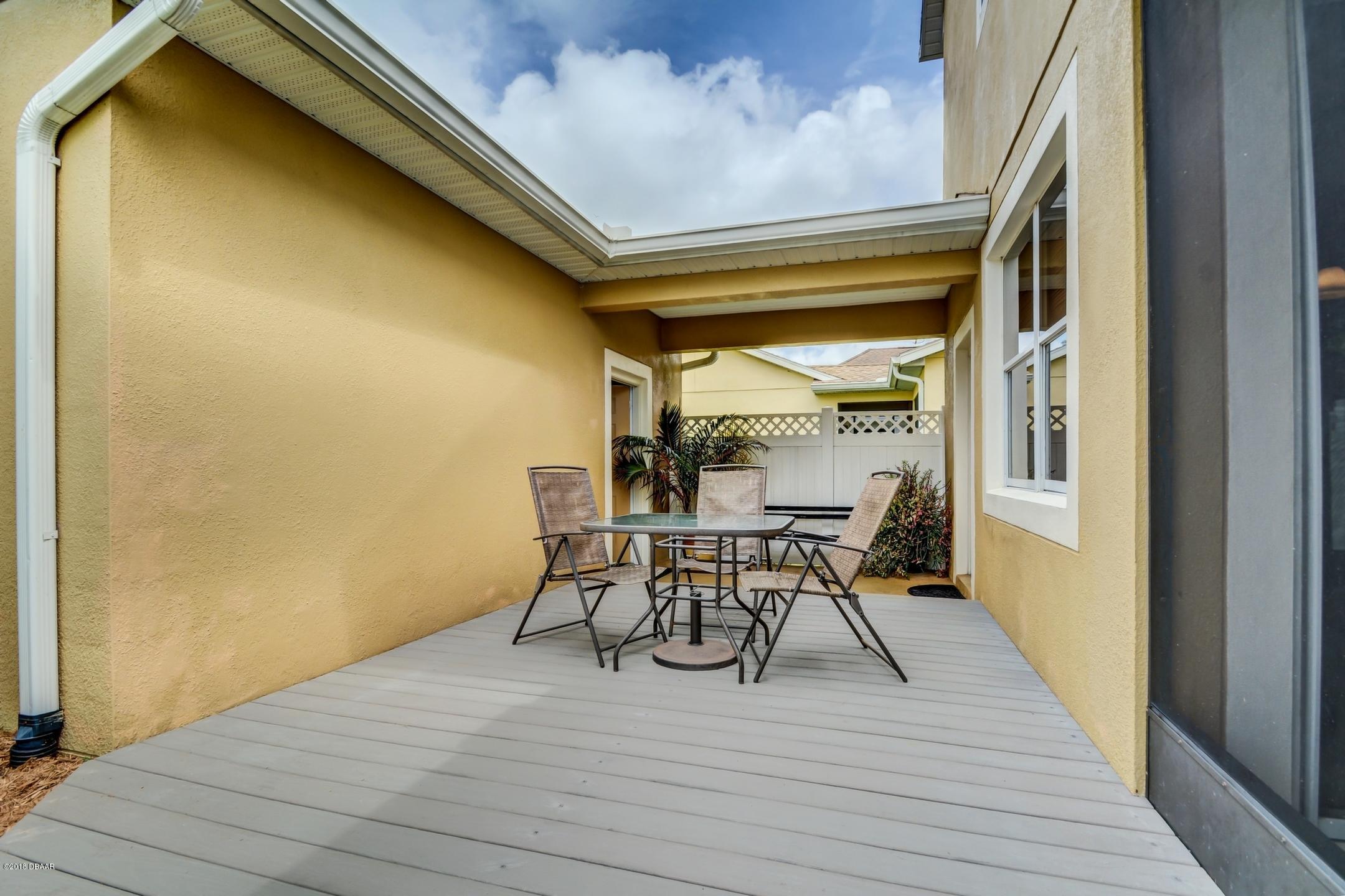 409 Manor View Lane DeLand, FL 32724 - Photo 26 of 31 a view of a dining room with furniture and wooden floor