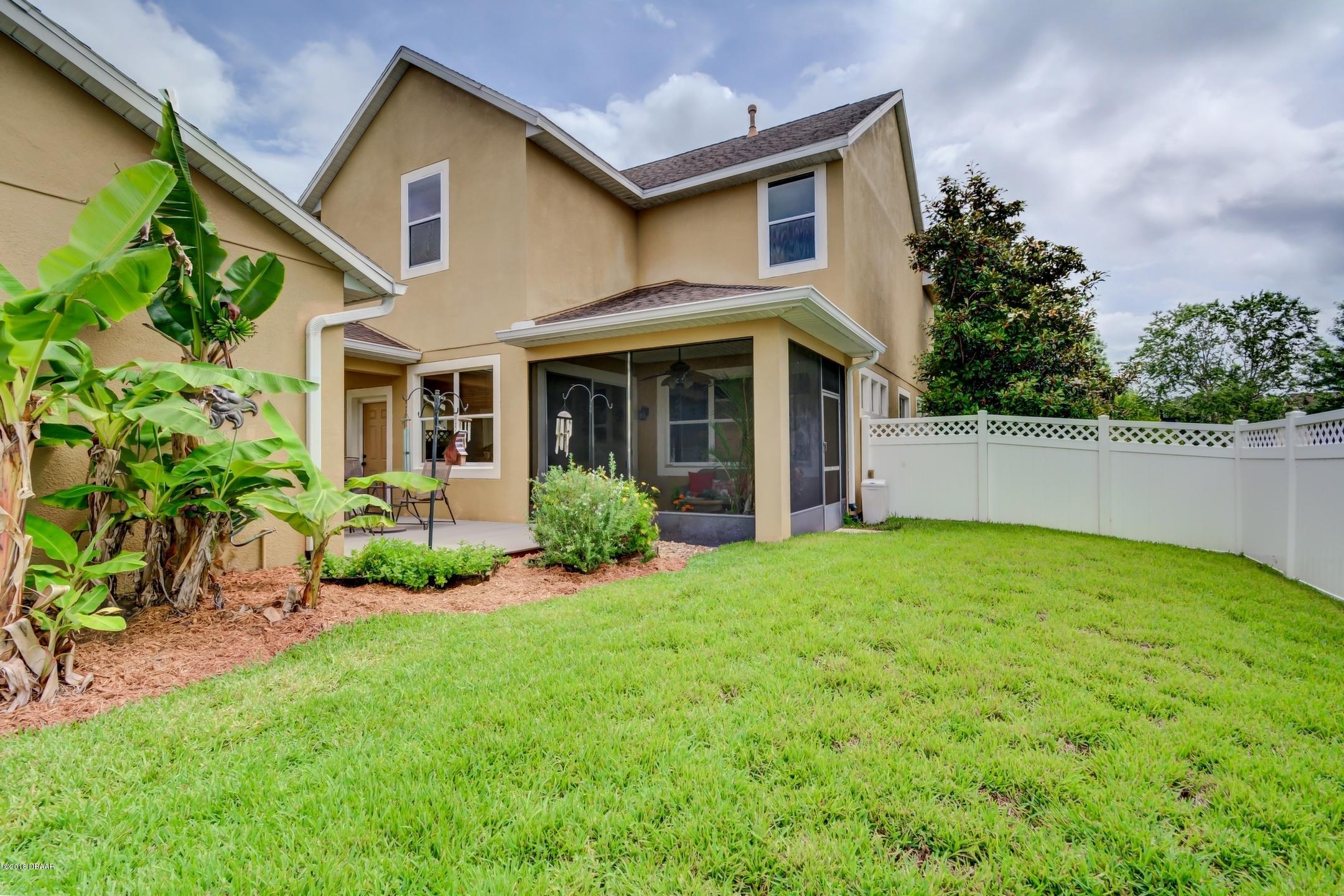 409 Manor View Lane DeLand, FL 32724 - Photo 28 of 31 a view of a house with backyard and garden
