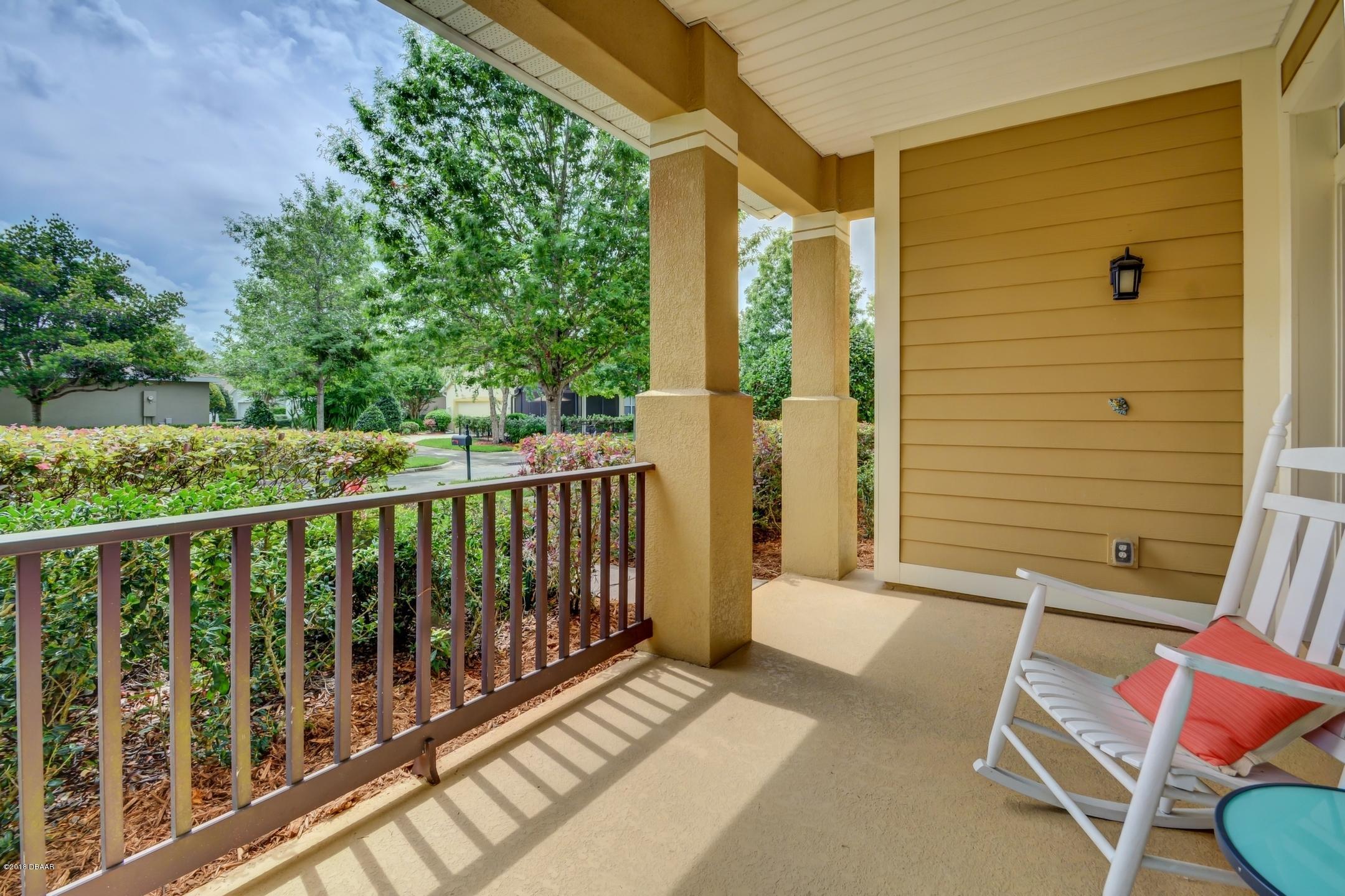 409 Manor View Lane DeLand, FL 32724 - Photo 3 of 31 a view of a balcony with chairs