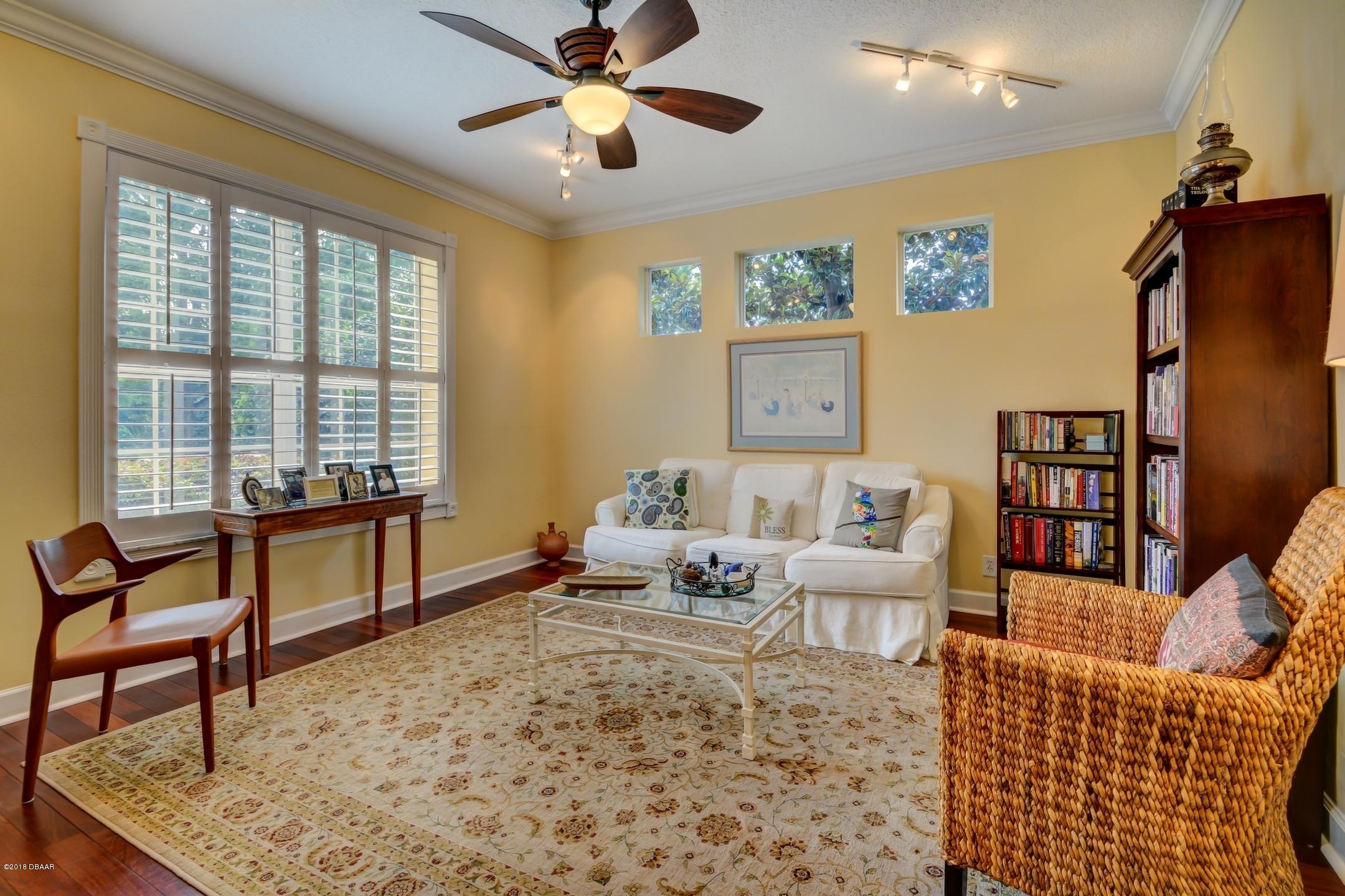 409 Manor View Lane DeLand, FL 32724 - Photo 4 of 31 a living room with furniture and a window