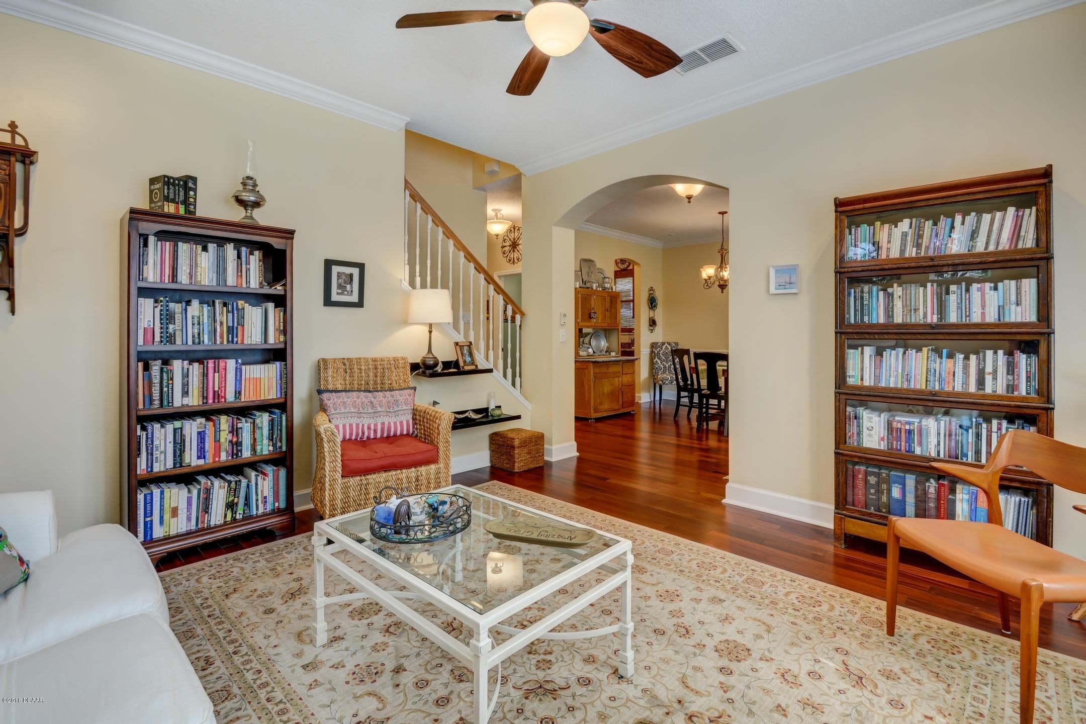 409 Manor View Lane DeLand, FL 32724 - Photo 5 of 31 a living room with furniture and a book shelf