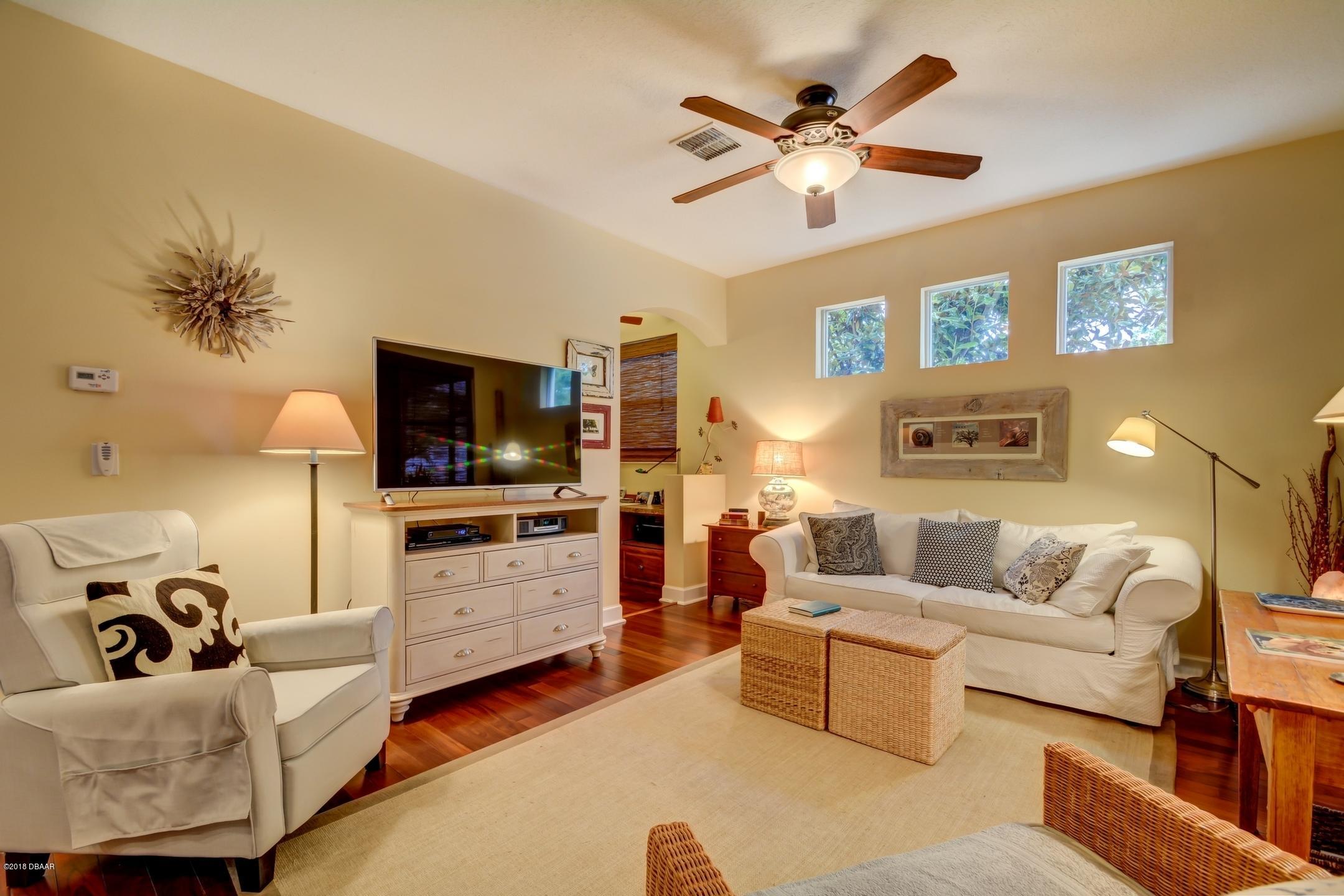 409 Manor View Lane DeLand, FL 32724 - Photo 7 of 31 a living room with furniture and a flat screen tv