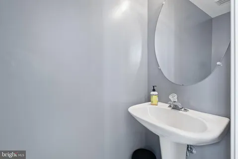 a spacious bedroom with a bed and a window