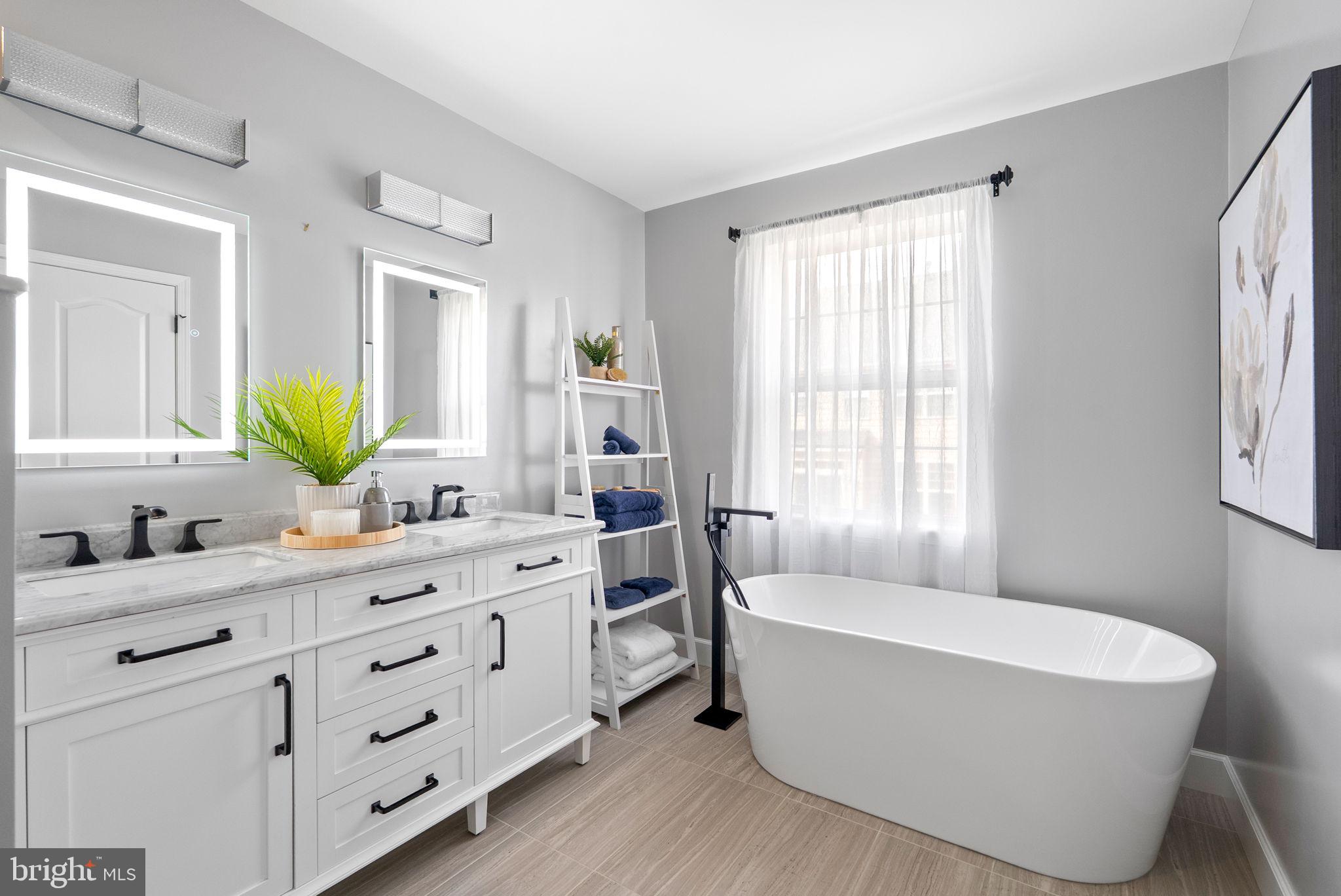 13368 Ferry Landing Lane Woodbridge, VA 22191 - Photo 23 of 44 a bathroom with a granite countertop tub sink a mirror a and a window