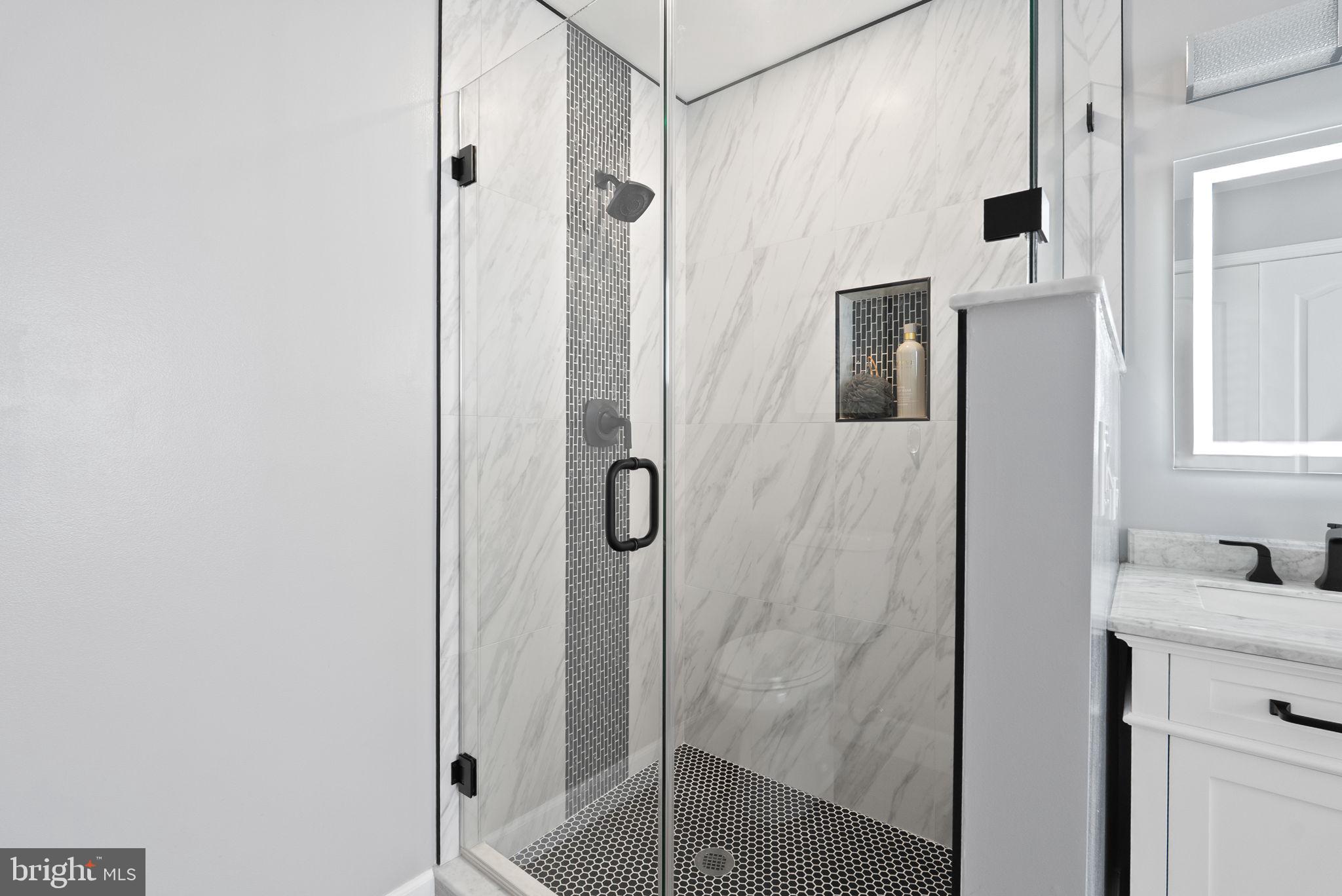 13368 Ferry Landing Lane Woodbridge, VA 22191 - Photo 24 of 44 a bathroom with a shower and a sink