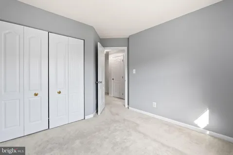 a view of a livingroom with a ceiling fan and window