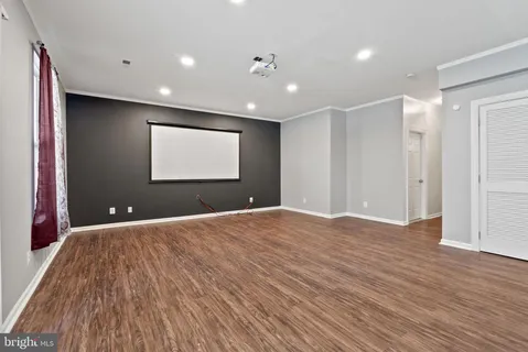 a bathroom with a sink mirror vanity and toilet
