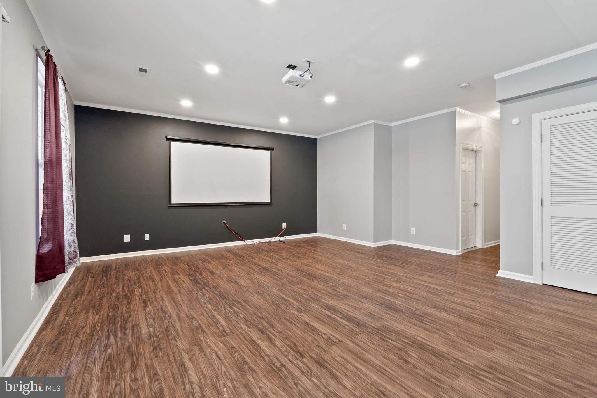 13368 Ferry Landing Lane Woodbridge, VA 22191 - Photo 33 of 44 a view of an empty room with wooden floor and window