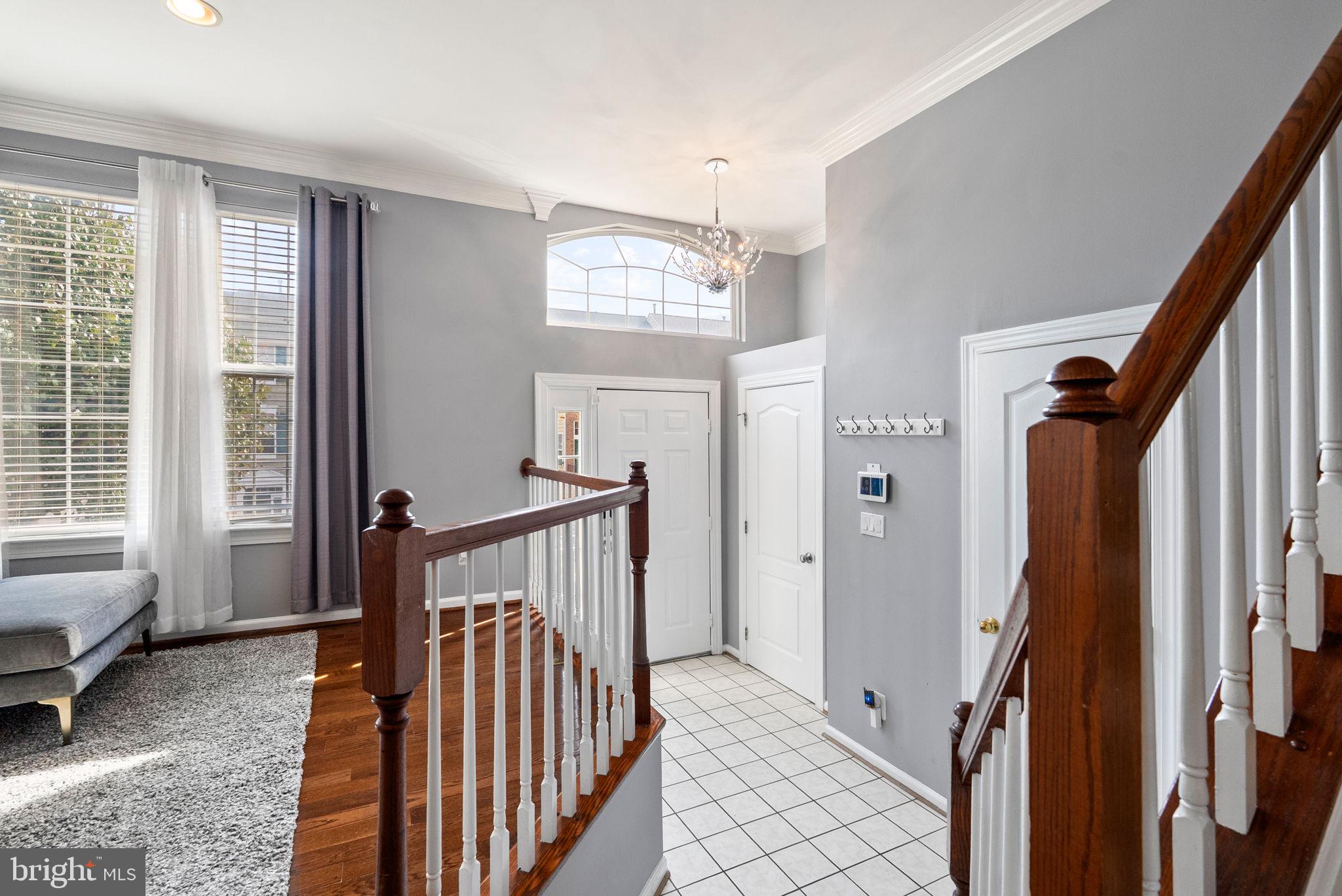 13368 Ferry Landing Lane Woodbridge, VA 22191 - Photo 7 of 44 a view of a hallway with windows and stairs