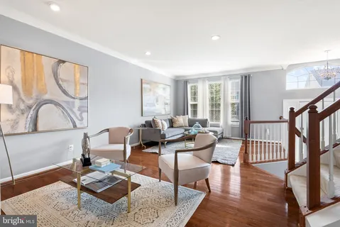 a living room with furniture and a rug