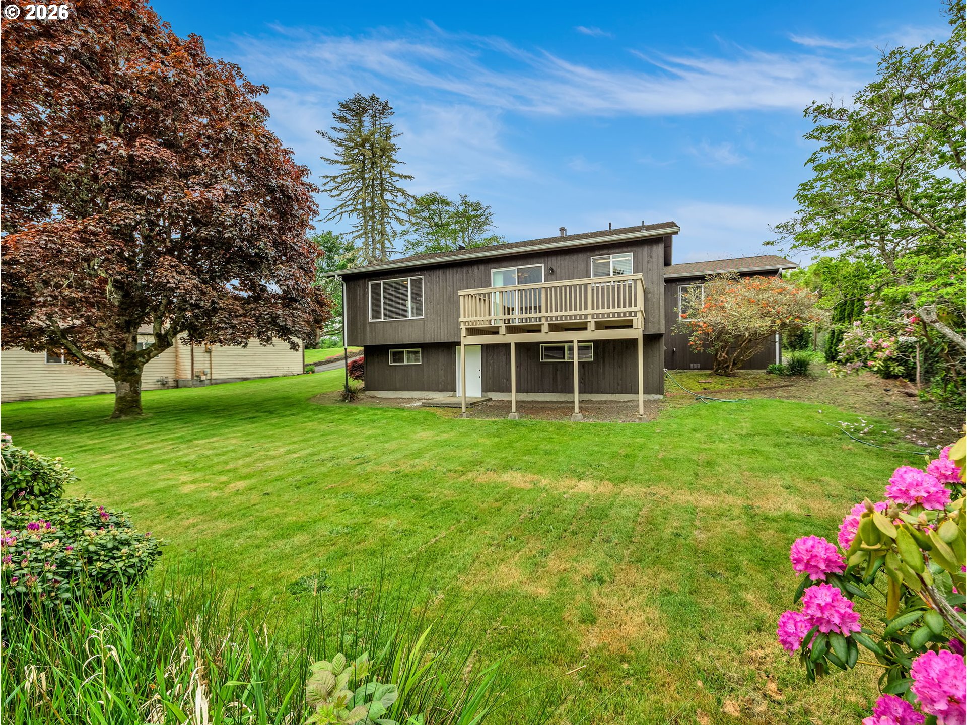 91923 Ridge Road Warrenton, OR 97146 - Photo 31 of 35 a view of a house with yard and a tree