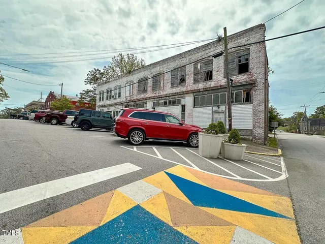 a cars parked on the side of a street