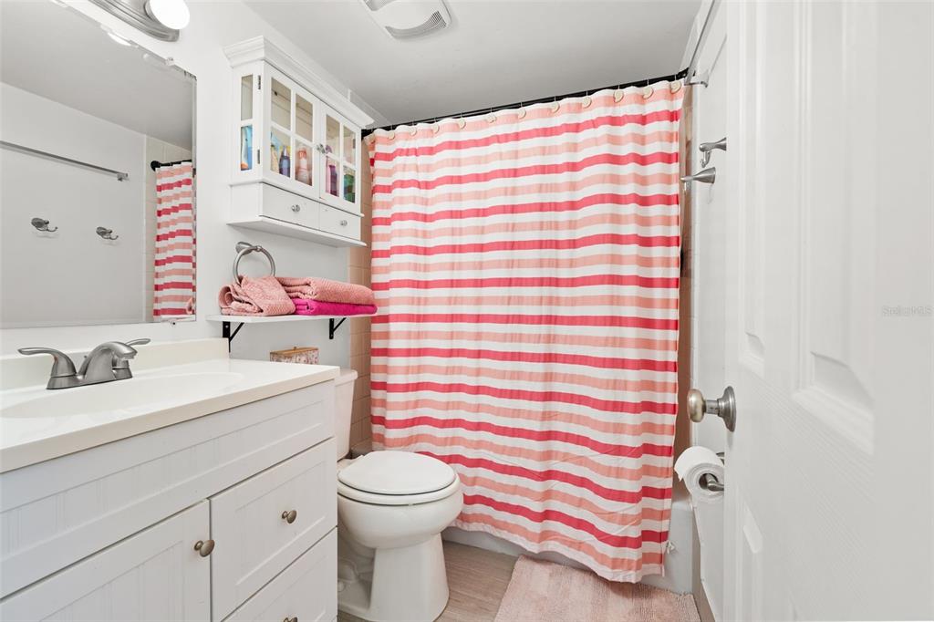 1700 Southwest 16th Court, Unit D30 Gainesville, FL 32608 - Photo 14 of 22 a bathroom with a sink toilet and shower
