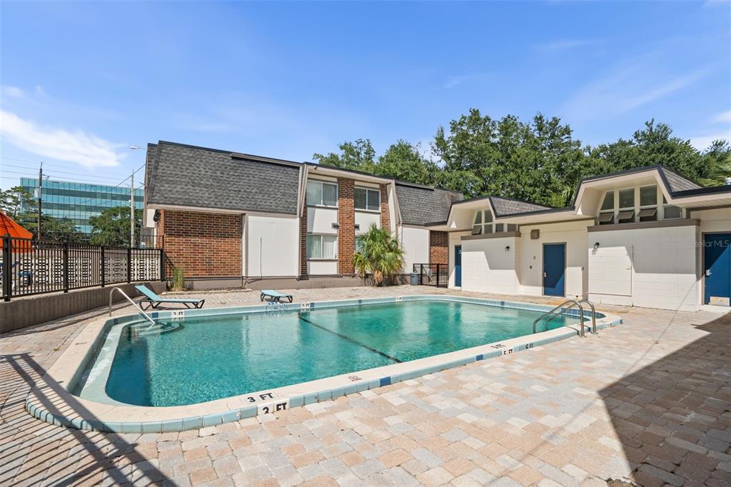 1700 Southwest 16th Court, Unit D30 Gainesville, FL 32608 - Photo 20 of 22 a view of a house with pool and sitting area