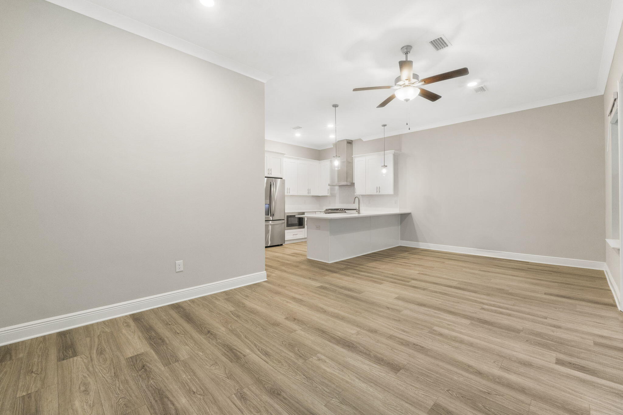 54 Kara Lake Drive Santa Rosa Beach, FL 32459 - Photo 17 of 41 a view of kitchen with wooden floor and window