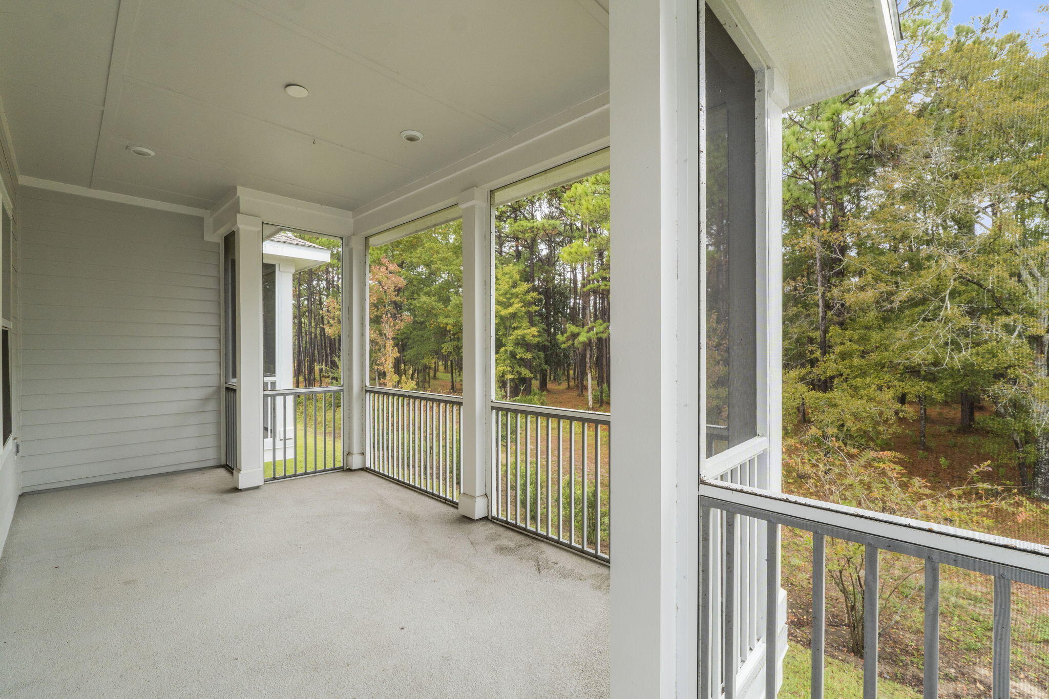54 Kara Lake Drive Santa Rosa Beach, FL 32459 - Photo 22 of 41 a view of empty room with floor to ceiling window and tree