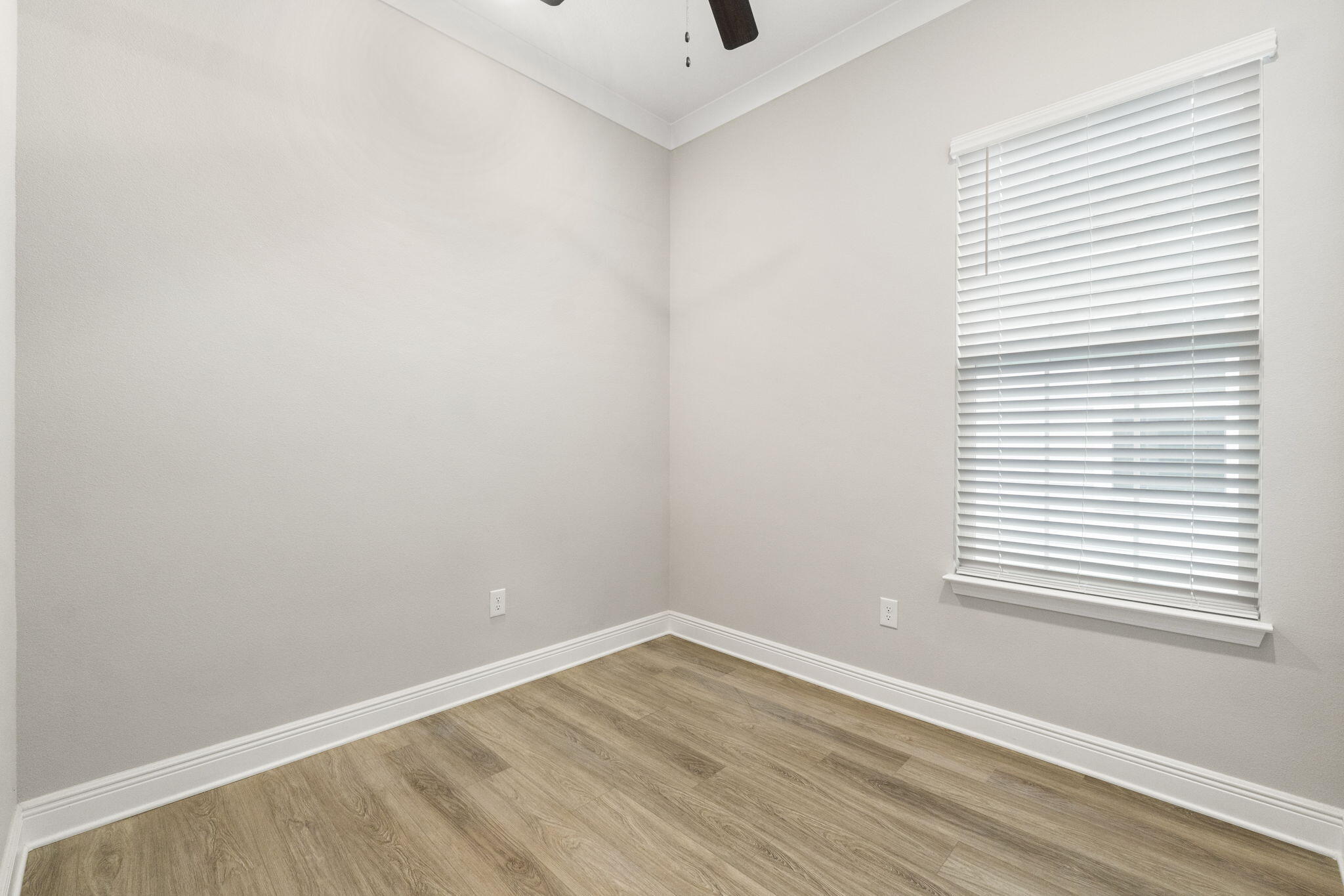 54 Kara Lake Drive Santa Rosa Beach, FL 32459 - Photo 29 of 41 a view of an empty room with wooden floor and a window