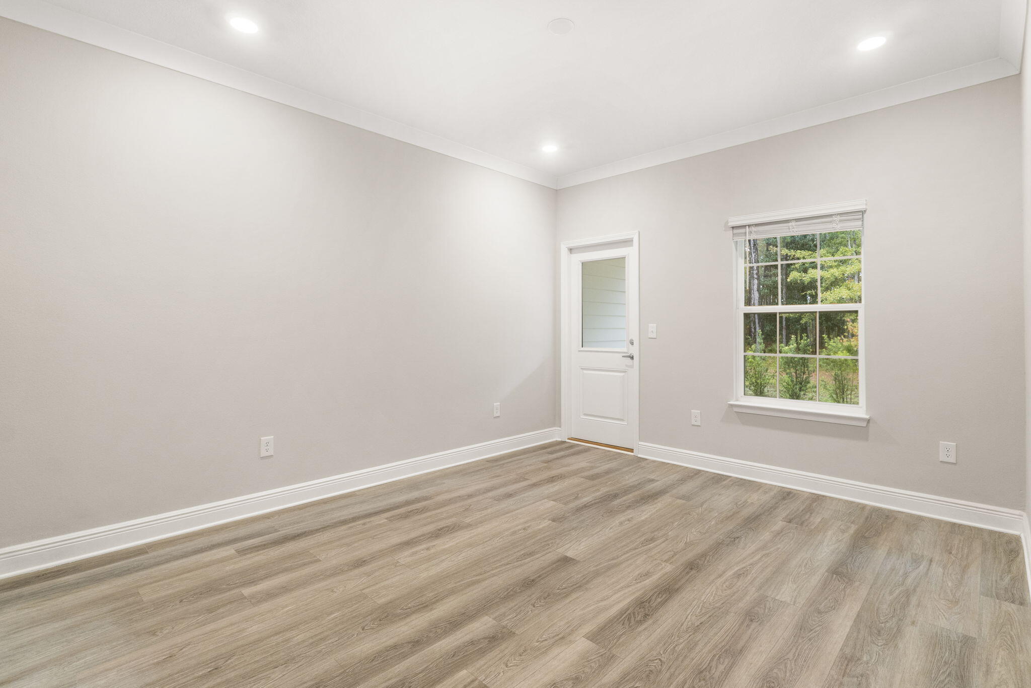 54 Kara Lake Drive Santa Rosa Beach, FL 32459 - Photo 7 of 41 wooden floor in an empty room with a window