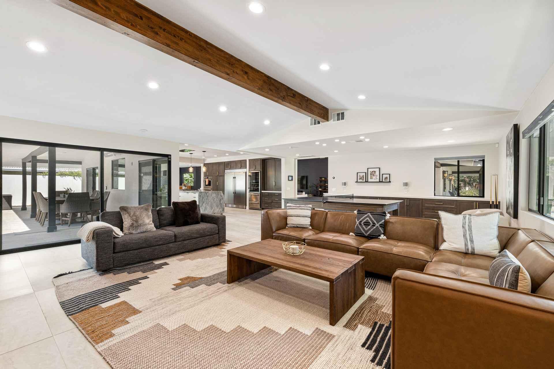 45655 Apache Road, Unit B Indian Wells, CA 92210 - Photo 23 of 31 a living room with furniture ceiling fan and a rug