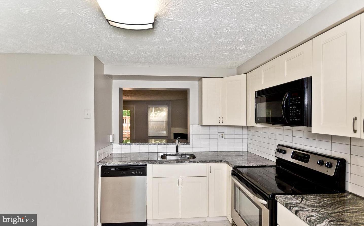 15781 Haynes Road Laurel, MD 20707 - Photo 12 of 34 Modern kitchen with sleek finishes.