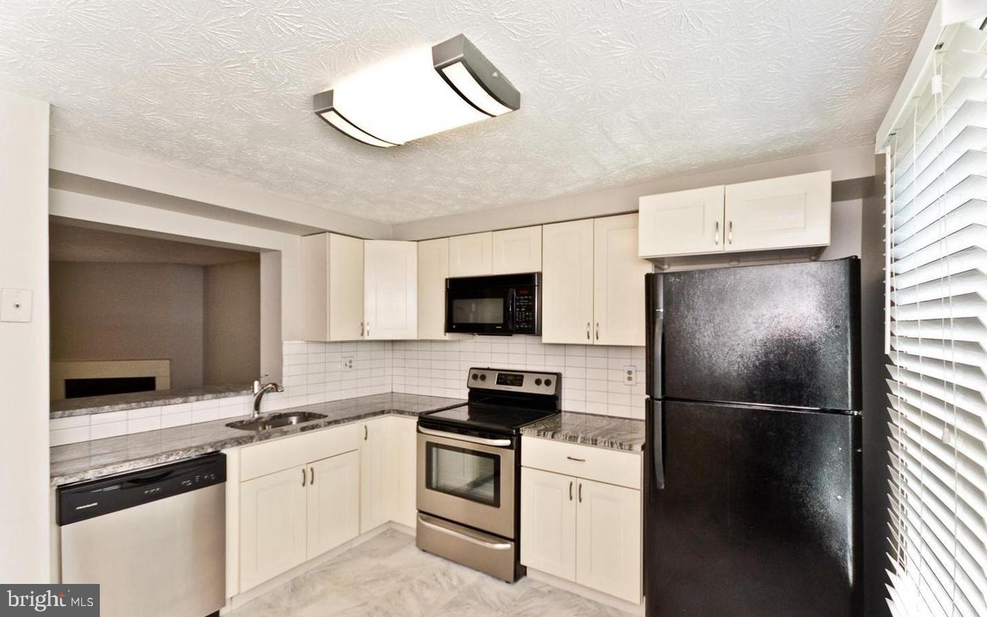 15781 Haynes Road Laurel, MD 20707 - Photo 13 of 34 Modern kitchen with sleek appliances.