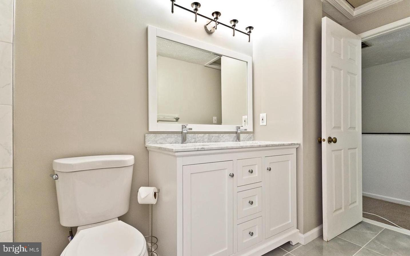 15781 Haynes Road Laurel, MD 20707 - Photo 20 of 34 Modern bathroom with elegant finishes.