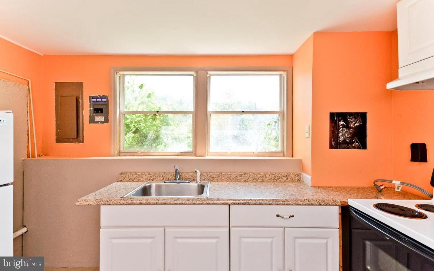 15781 Haynes Road Laurel, MD 20707 - Photo 29 of 34 Bright kitchen with vibrant orange walls.