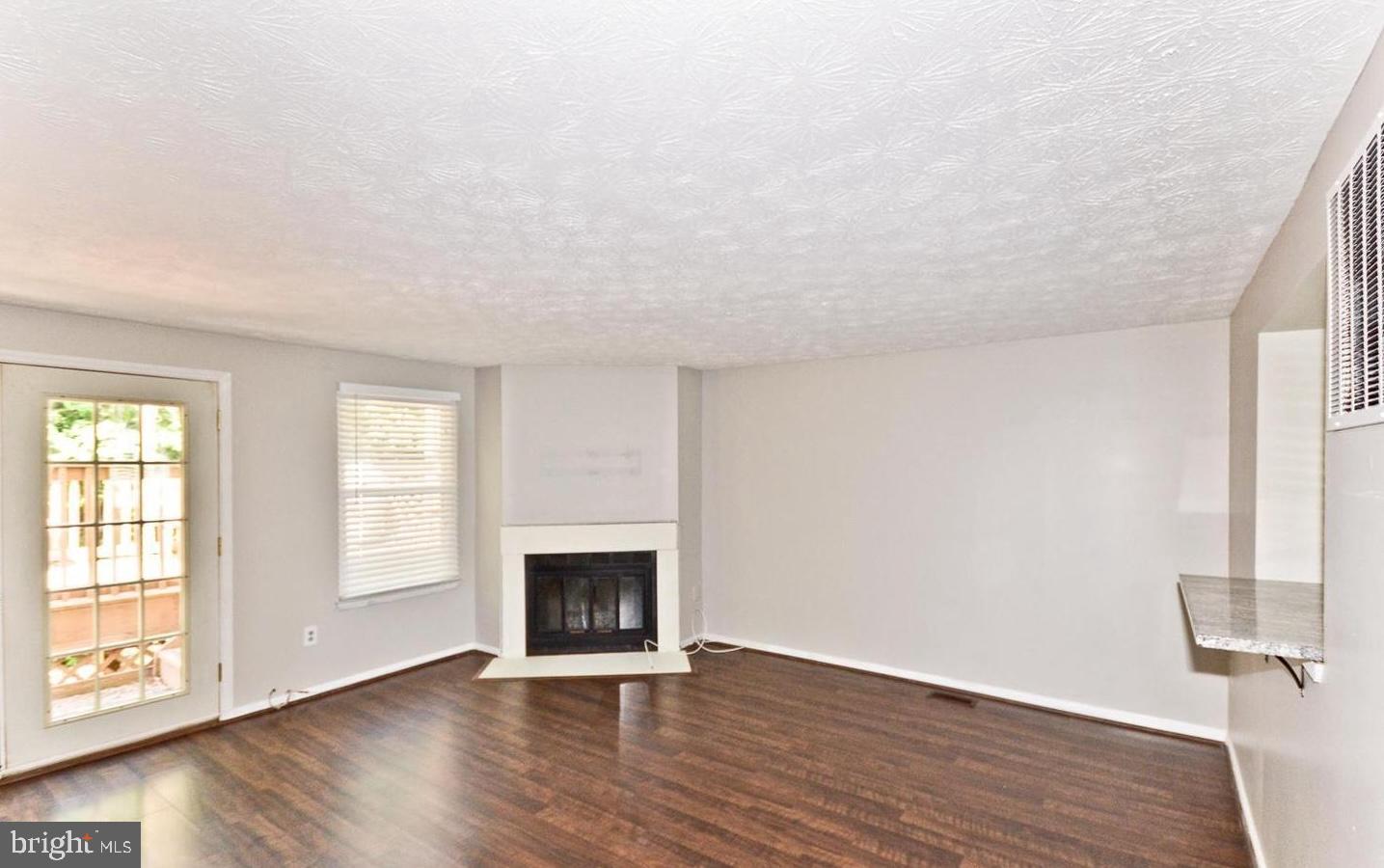 15781 Haynes Road Laurel, MD 20707 - Photo 5 of 34 Spacious living area with inviting fireplace.