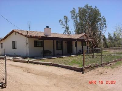11193 Mills Road Apple Valley, CA 92308 - Photo 1 of 1 a view of a house with backyard