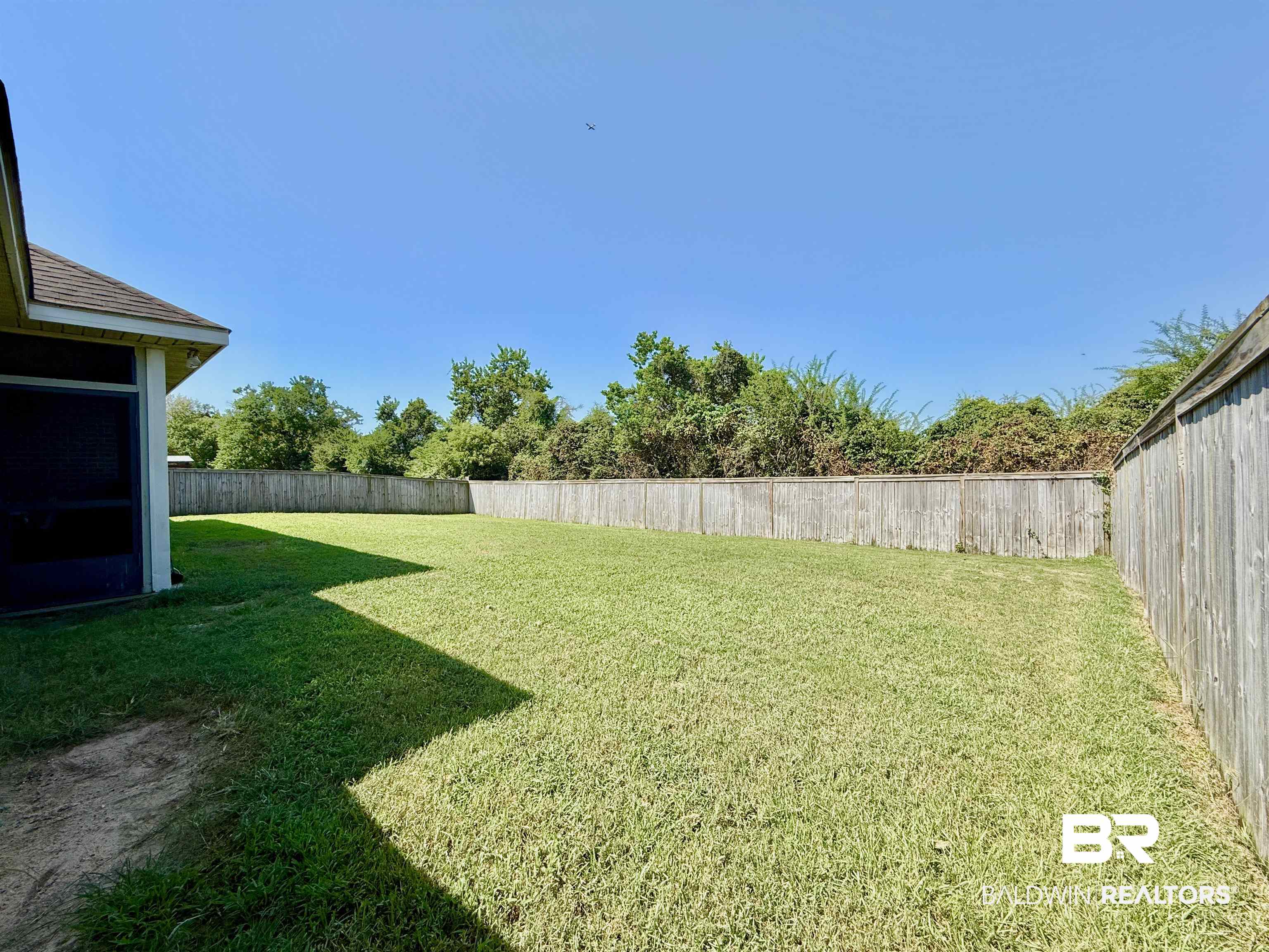 7011 Rocky Rd Loop Gulf Shores, AL 36542 - Photo 44 of 66 View of fenced backyard
