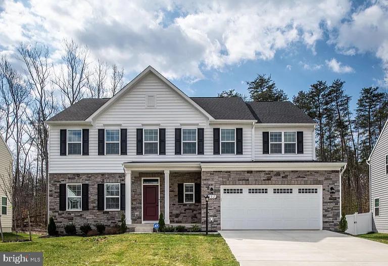 202 Grisham Road Stafford, VA 22554 - Photo 1 of 63 a front view of a house with yard and garage