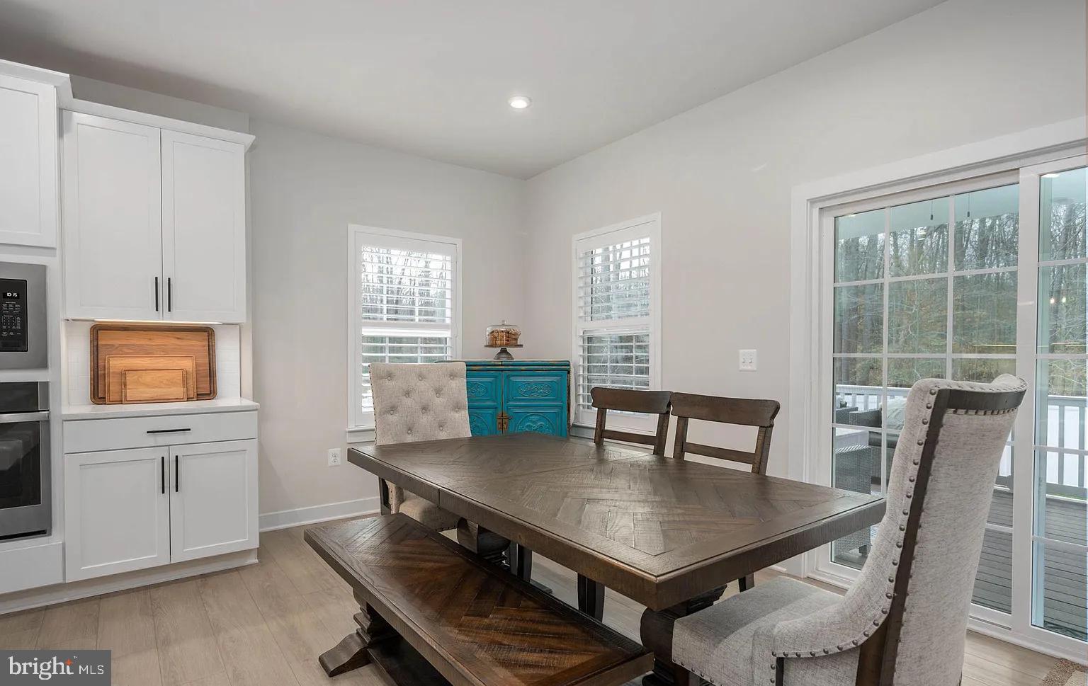 202 Grisham Road Stafford, VA 22554 - Photo 12 of 63 a view of a dining room with furniture and wooden floor