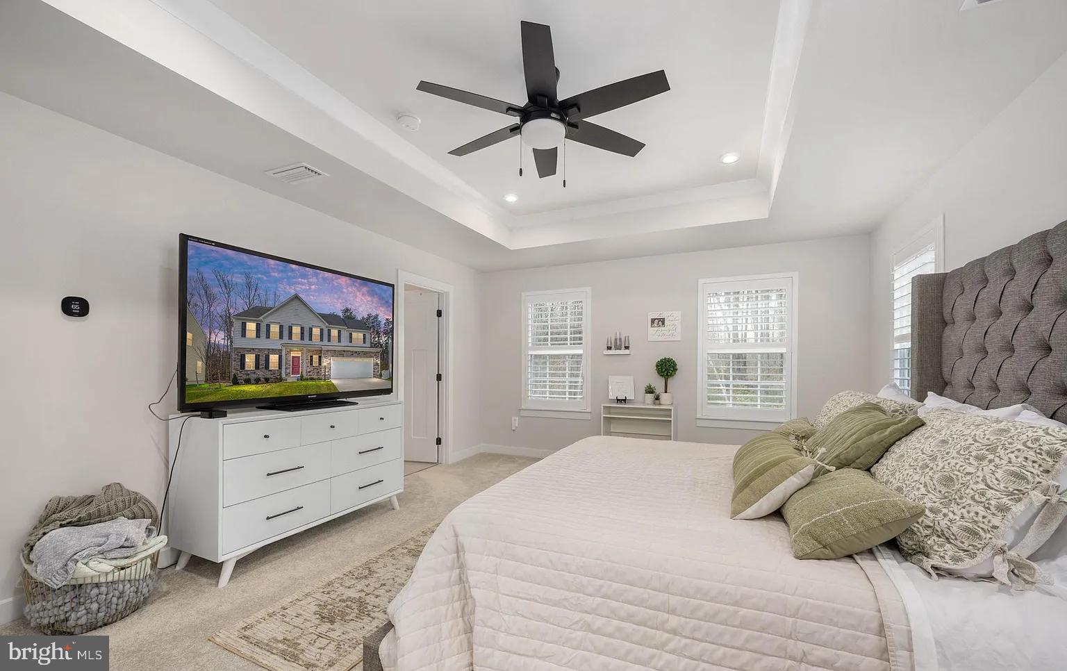 202 Grisham Road Stafford, VA 22554 - Photo 34 of 63 a bedroom with a bed and a flat screen tv