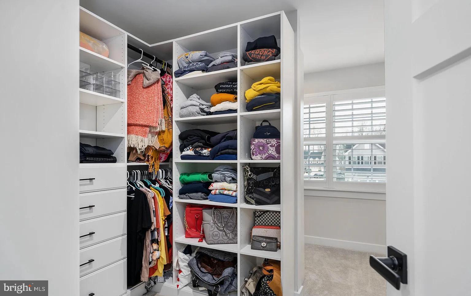 202 Grisham Road Stafford, VA 22554 - Photo 35 of 63 a view of walk in closet with clothes and shoes